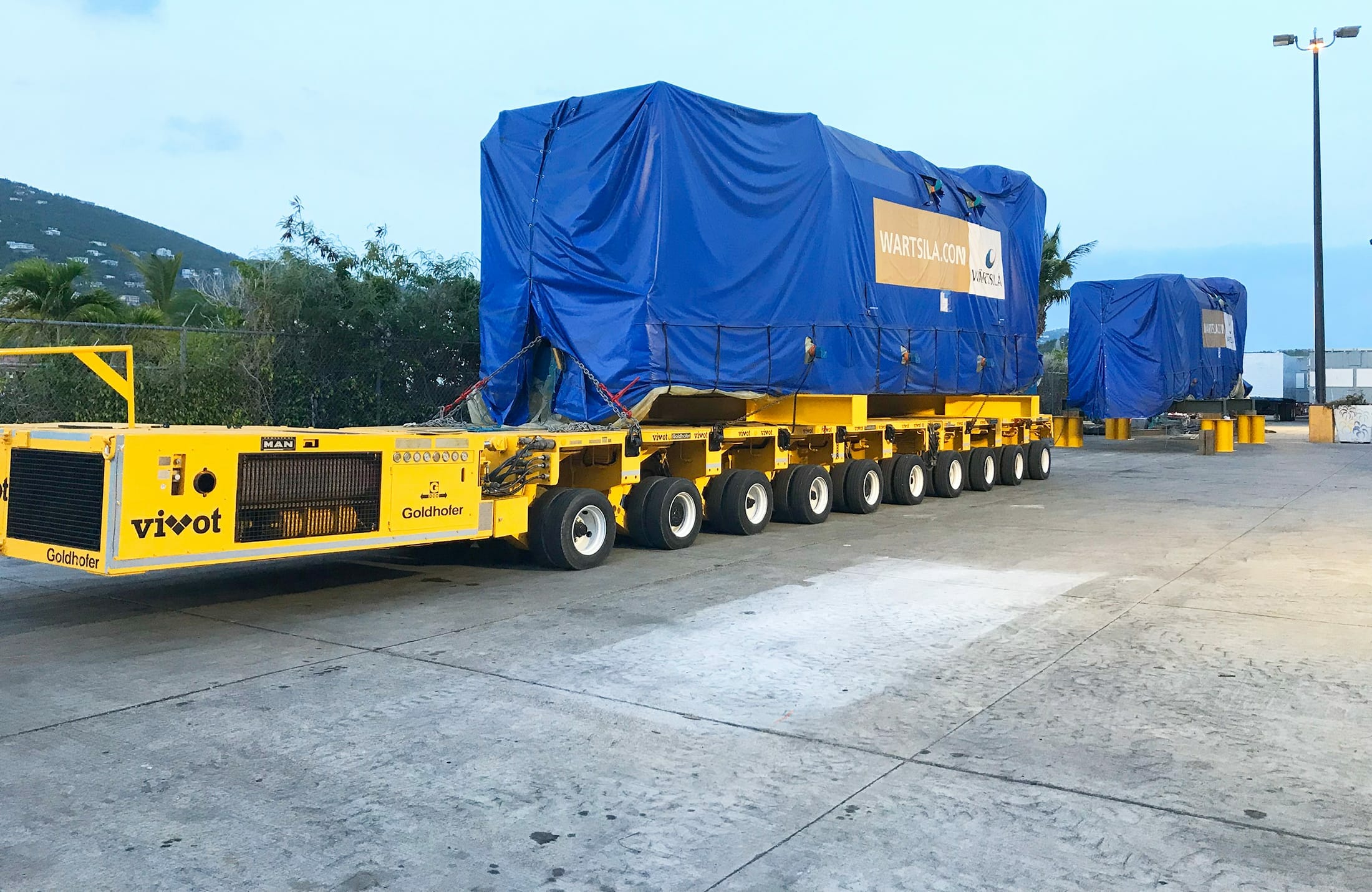 multi-wheeled equipment hauling heavy load
